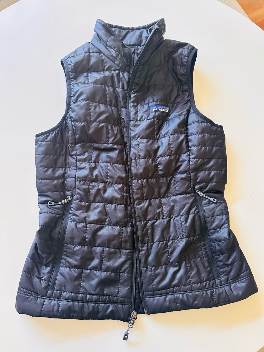 Patagonia Women’s Black Puffer Vest with Color-Strip Logo